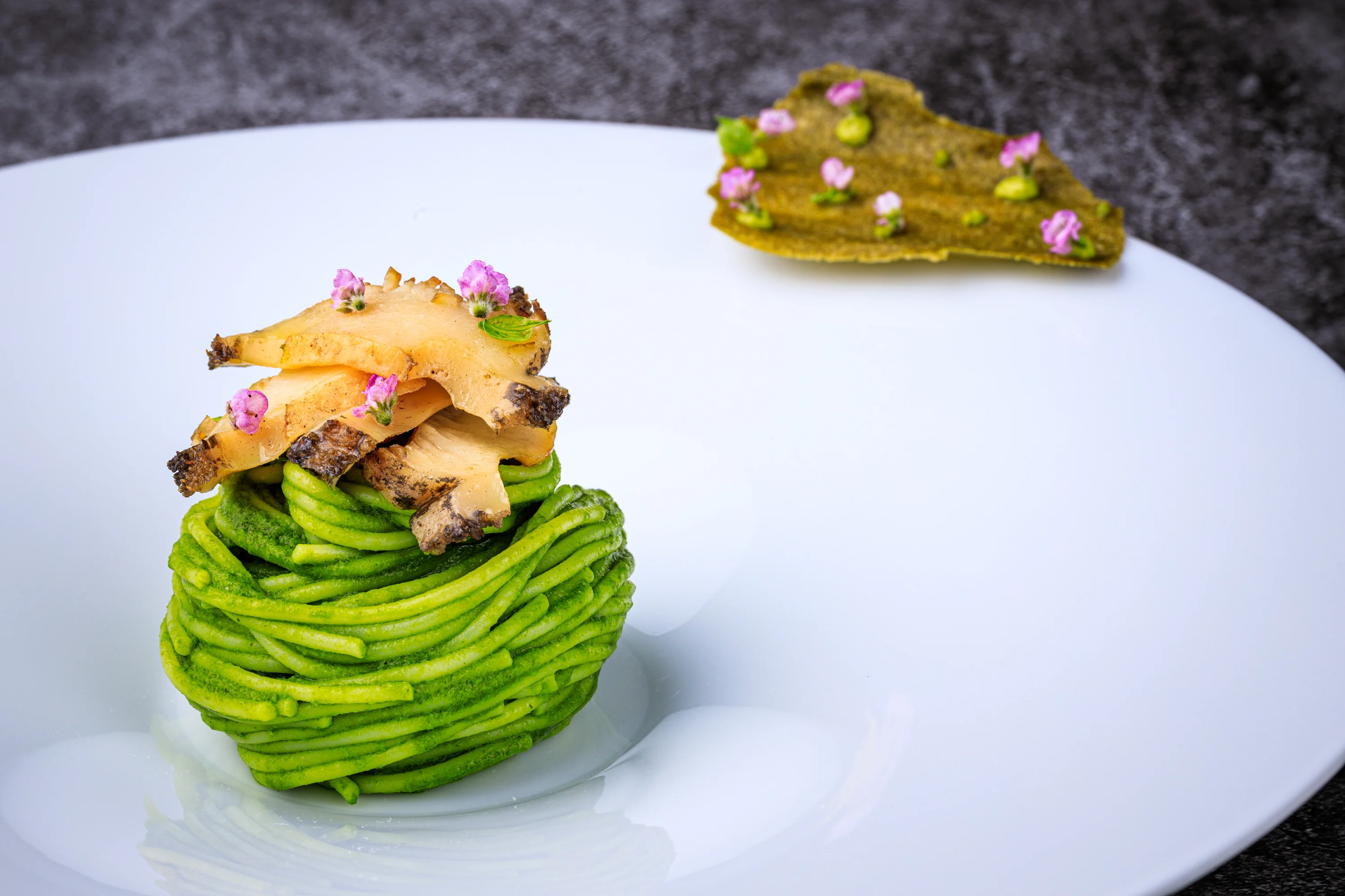 Fresh pasta with shellfish, herbs and edible flowers.