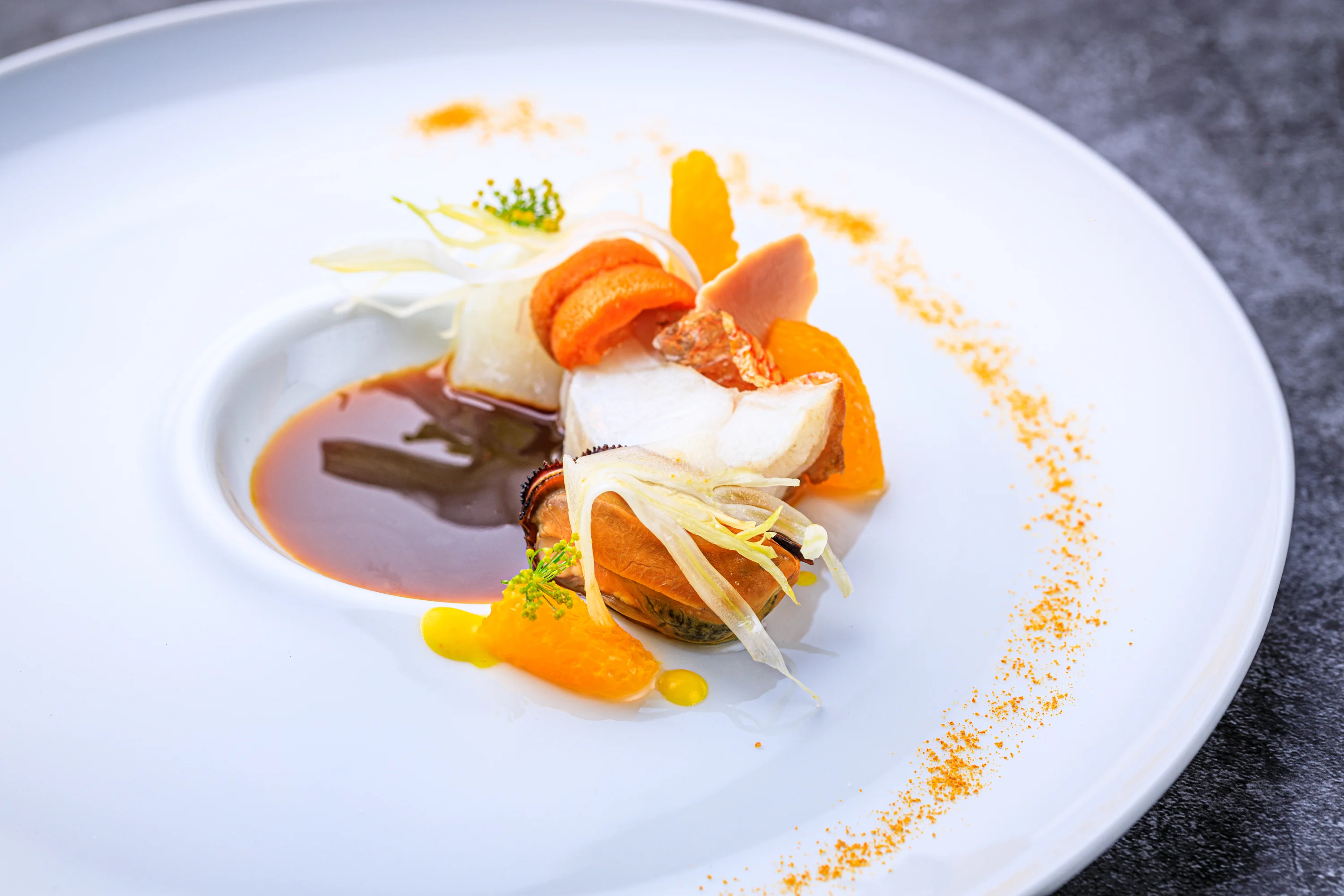 A delicate tasting-menu course with ribbons of vegetables and sauce.